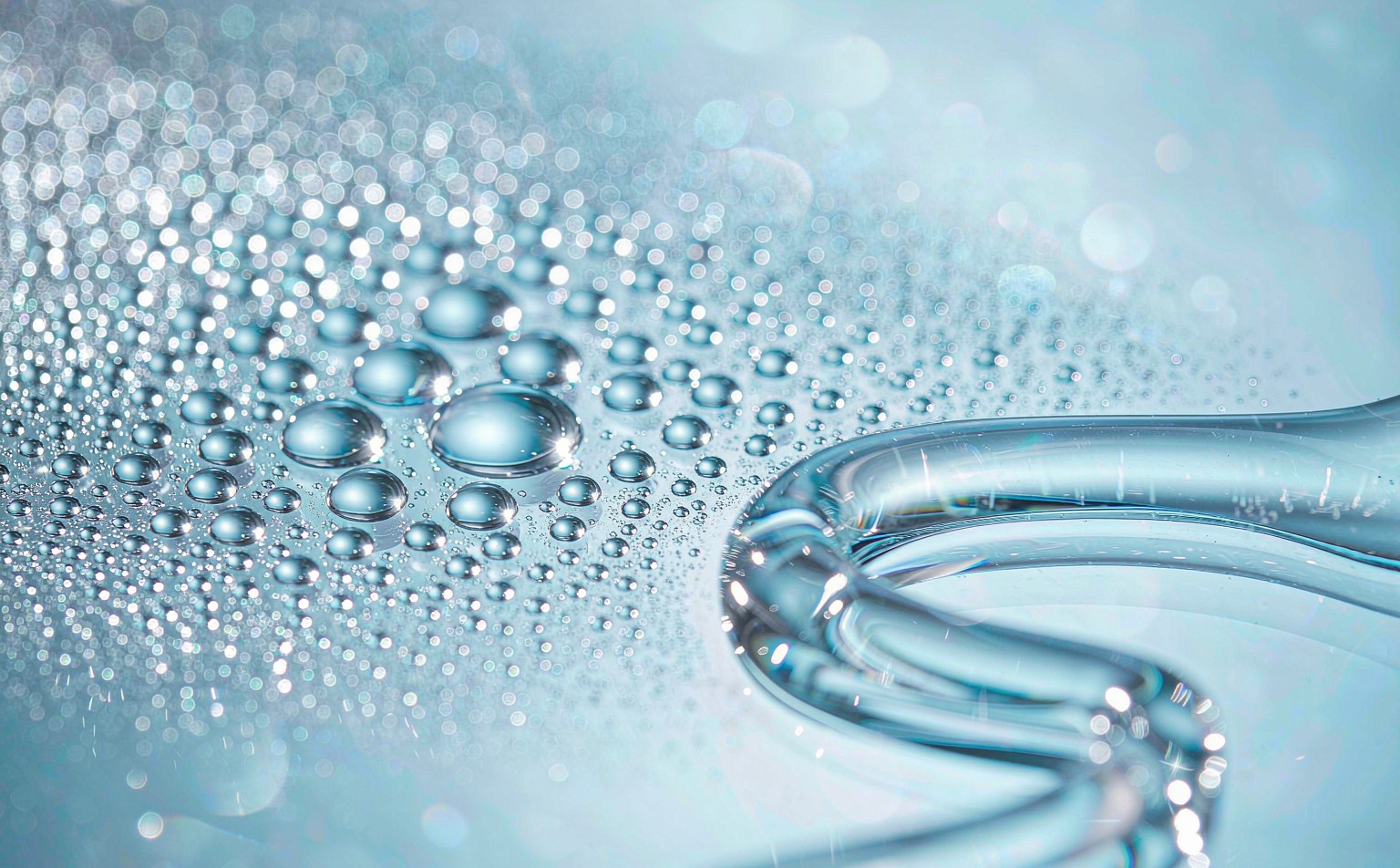 Close-up texture of a transparent hydrating hyaluronic acid serum with water droplets